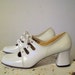 RESERVED Vintage 1960s Mary Janes white lace up 2 1/2 inch heel excellent condition size 9