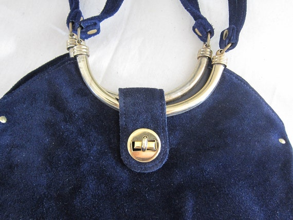 navy and gold handbag