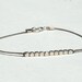 Gray silk thread bracelet with 10 Sterling Silver beads