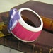 StayGoldMaryRose - Striking fuchsia pink/ gold band with internal flower pattern tea cup bracelet with light mauve handmade satin bow.