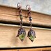 Filigree Earrings in Copper and Green with sparkling faceted green beads like green buds