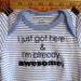 I just got here & I'm already awesome --- blue striped bodysuit size newborn