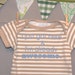 I just got here & I'm already awesome. --- brown striped onesie, size 0 - 3 months.