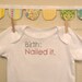 birth: nailed it --- white onesie, size newborn --- pink