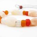 Viking reproduction beads tied into adjustable necklace - Pale pink quartz with red, orange and clear glass beads