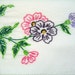 Two colorful hand embroidered queen size pillowcases in flower motif.