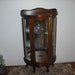 vintage curio cabinet half-round wood and glass