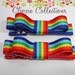 Pair of boutique mini hair bow clippies - Rainbow stripes - no slip grip