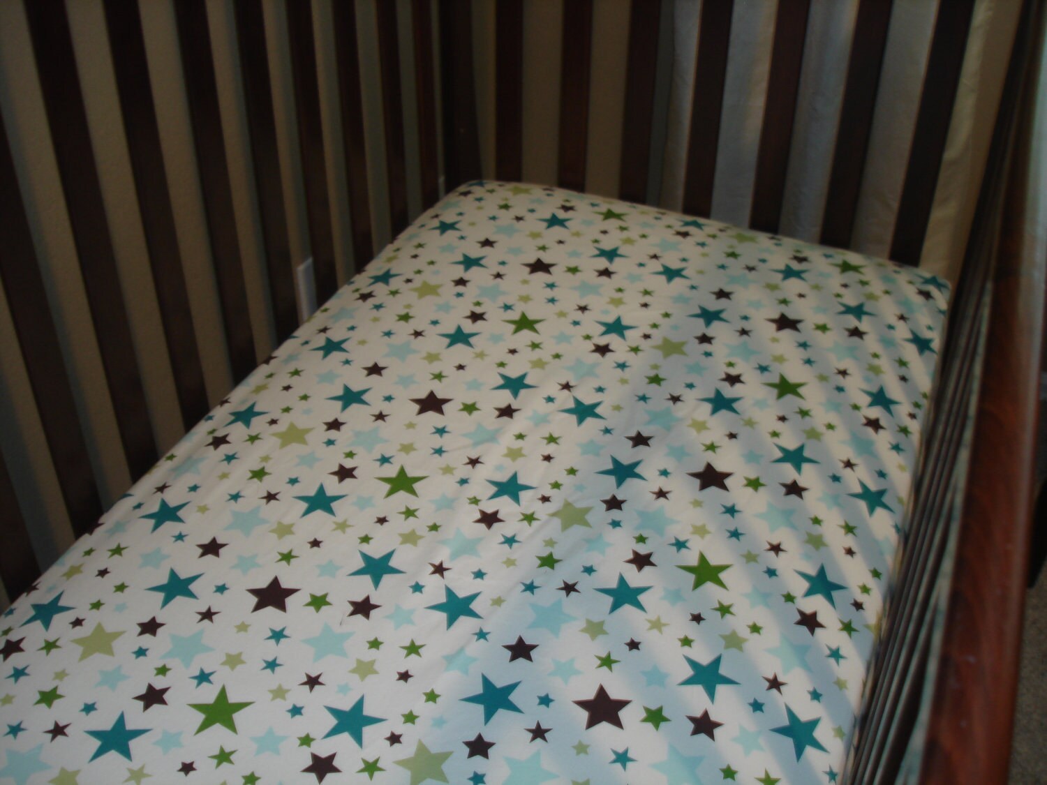 Custom fitted crib sheet in Retro wagons and by SweetDreamsBedding