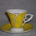 Set of six (6) porcelain, Italian style, demitasse cups and saucers in rich yellow with white, green, and gold