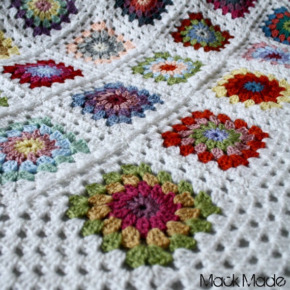 Pretty bright starburst granny square crochet blanket with