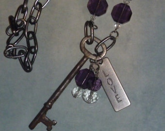 Vintage skeleton key, purple beads and love charm