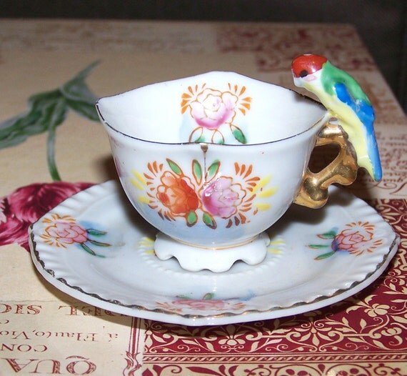 Miniature Tea Cup with Parrot Handle and Saucer