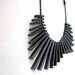 contemporary geometric minimal black necklace with sticks and beads