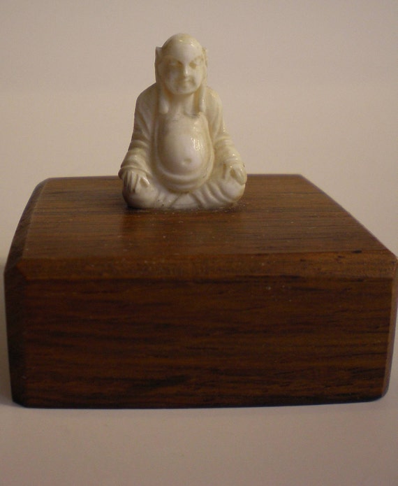 small carved ivory buddha