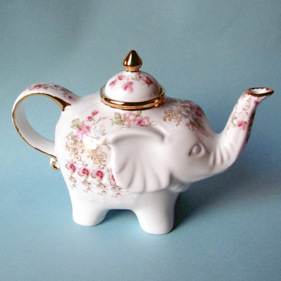 shabby chic elephant teapot with pink colored blossoms and shabby chic elephant teapot with pink colored blossoms and