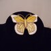 Vintage yellow and white butterfly brooch