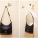 Dooney and Bourke Navy Pebble leather with tan color leather trim shoulder bag
