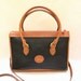 Dooney and Bourke Black Color Pebble Leather and Tan Color Leather Trim Shoulder bag, Large size , Cross Body Shoulder Bag., Large Size Bag