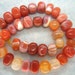 Genuine Orange Red Lace Agate Smooth Nugget Beads - 16 Inch Strand
