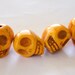 Golden Yellow Stone Skull Beads