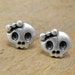 Tiny sterling silver girly skull studs with bow. Two adorable dead girls. Cute and creepy