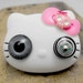 Steampunk Hello Kitty brooch with a compass eye