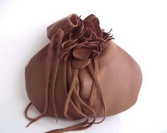 leather wristlet in light brown with detachable flower,hat pin or brooch by Tuscada. Ready to ship.