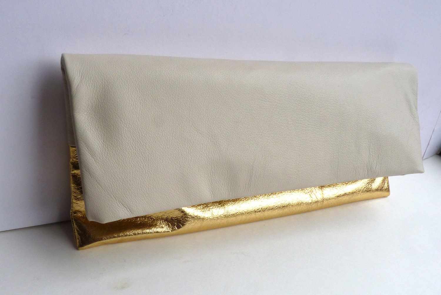 Two tone leather clutch purse cream and metallic gold