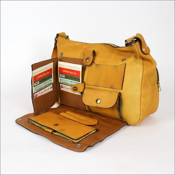 leather travel satchel / late 70s orange saddle leather buckle