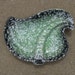 mid century ameba shaped ceramic ashtray black green white speckled marked USA