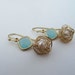 Blue Ice Earrings- Freshwater pearls wrapped in gold wire and blue/ice gold faceted connector