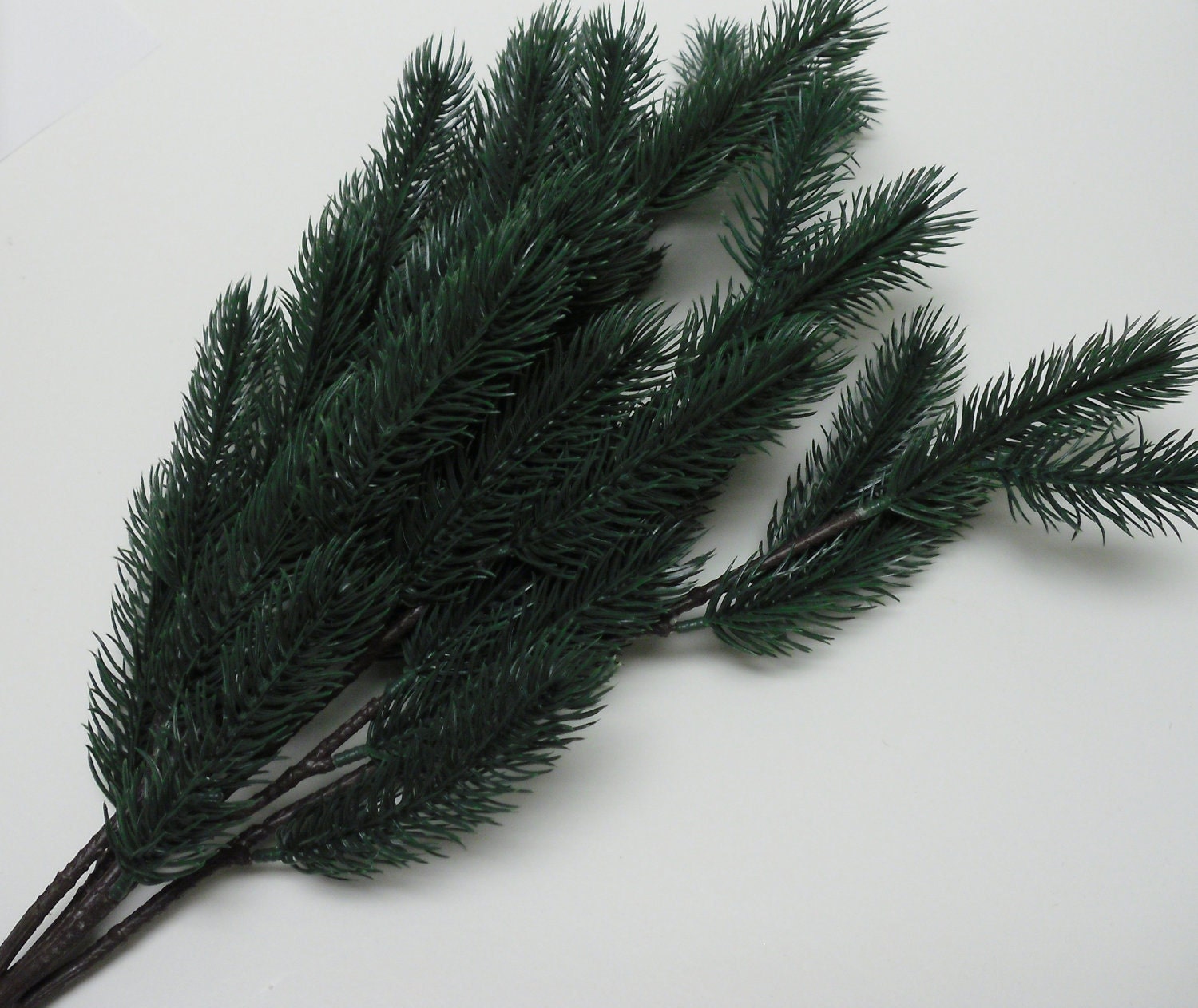 artificial pine boughs        
        <figure class=