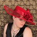 red wide brimmed Kentucky Derby