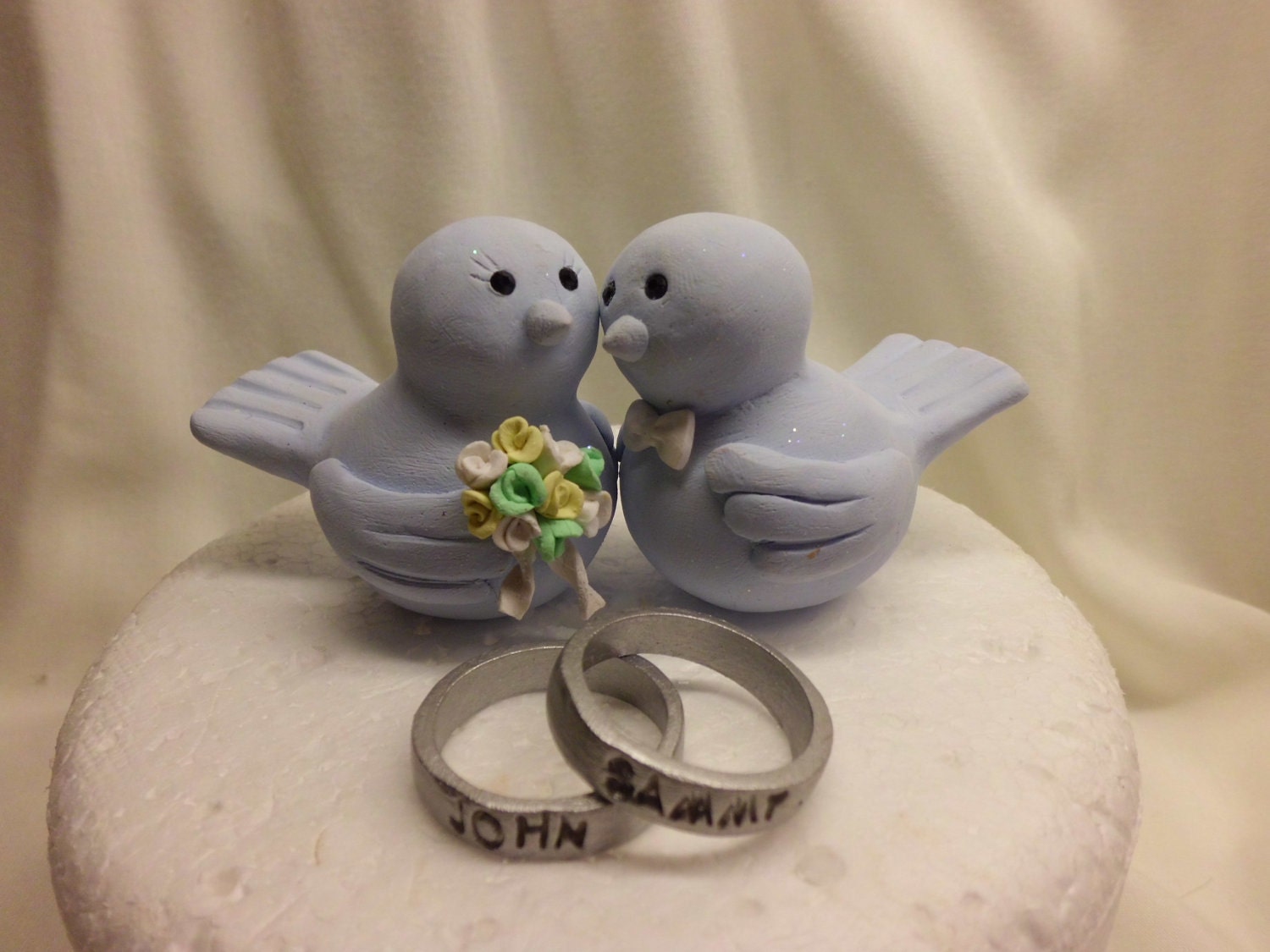 Love birds with personalized wedding rings