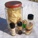 Antique pharmacy bottle eclectic collection: oil extracts, wintergreen, cloves, oil of cinnamon spices, pair dice, Heinz 57 baby food jar.