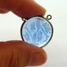 Excetional antique reverse intaligo art nouveau lilly of the valley sterling silver over brass pendant