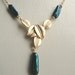 Dark teal keishi pearls necklace with 16Kt gold plated leaf