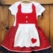 Red German button dirndl with double layered skirt