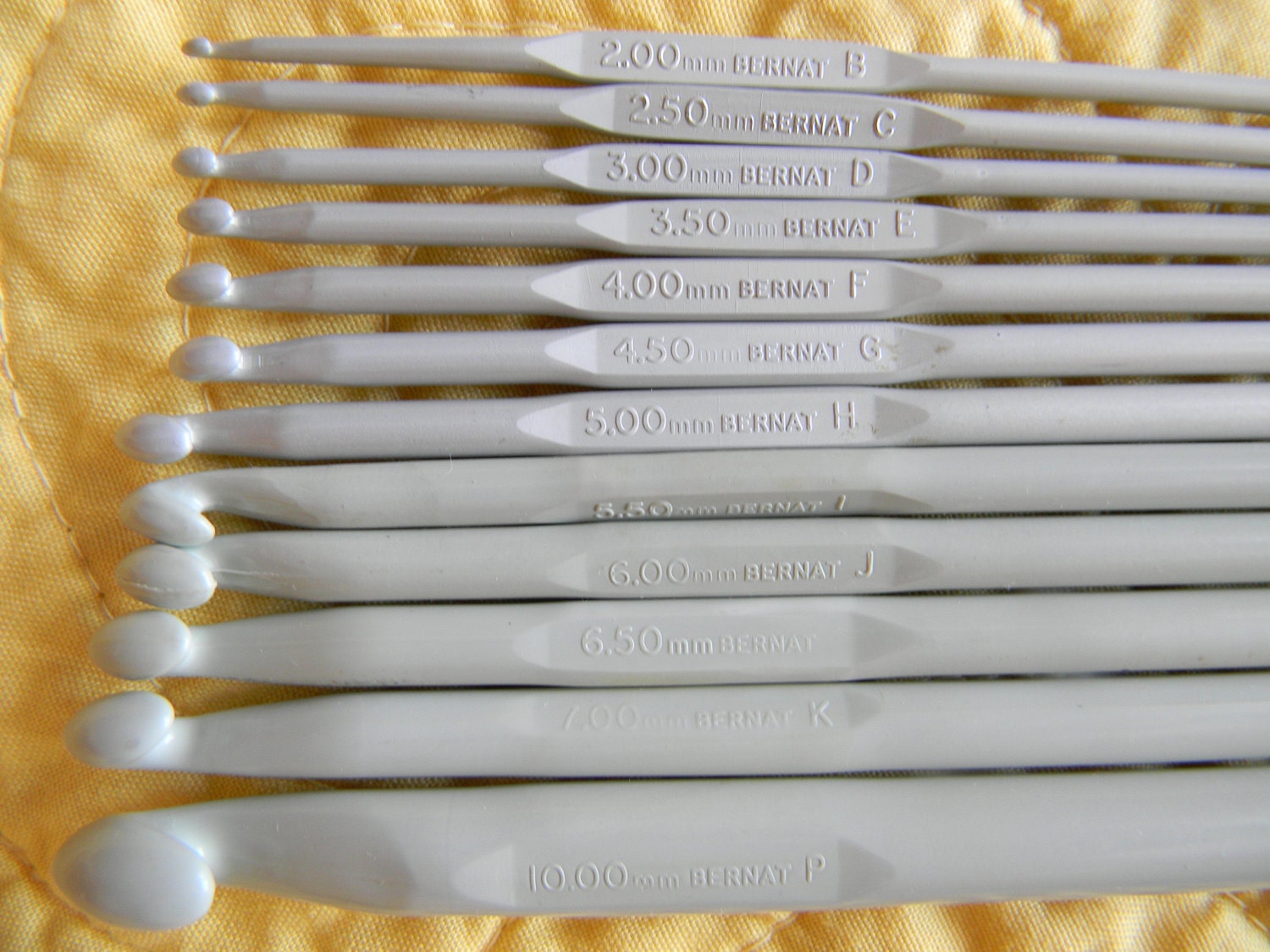 Fourteen Crochet Hooks Bernat Aero Needle set with two Susan