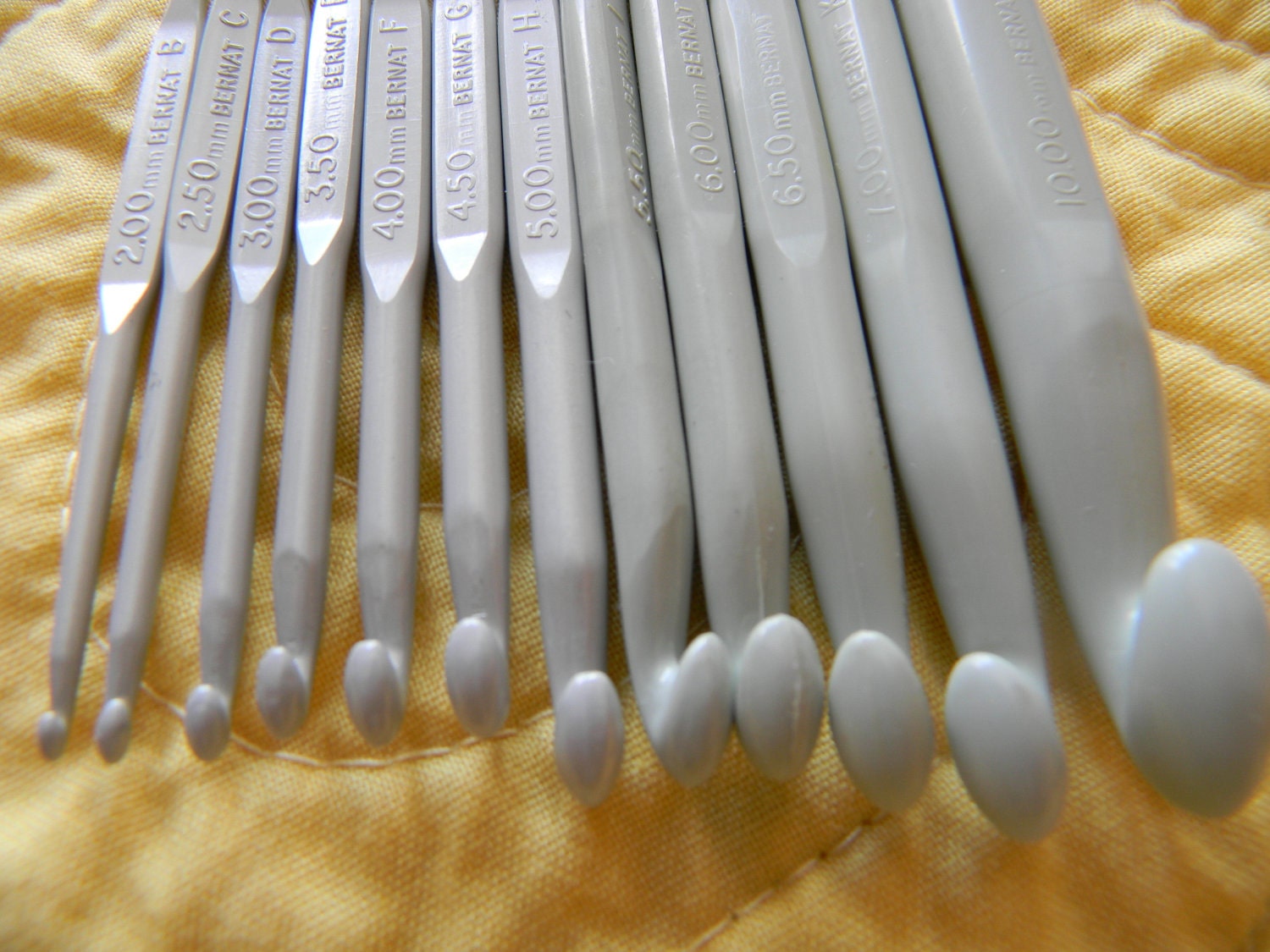 Fourteen Crochet Hooks Bernat Aero Needle set with two Susan