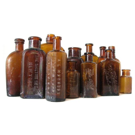13 antique brown glass bottles