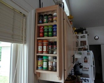Wall mounted solid wood spice rack.