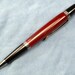 A long single barreled pen with bloody basin jasper