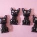 Black cat sitting down quietly cabochons 4 pcs