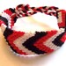 Red, white and black knotted friendship bracelet