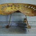 lemon yellow rusty metal tractor seat