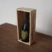 Miniature champagne Dom Perignon in wooden box