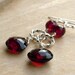 Garnet Earrings with twisted circles Sterling Silver Deep Red Gemstone January birthstone