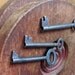 Three Antique Skeleton Keys with Matching Oval Bows and Great Notched Bits. All One Price.
